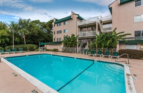 Saint Simons Island Condo | Directly on Best Part of Ocean Boardwalk to Beach! Modern with Balcony and Pool!