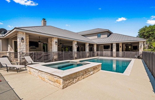 Concan House | Directly ON the Frio River, private golf cart/walking path, hot tub, swimming pool, 3 master suites