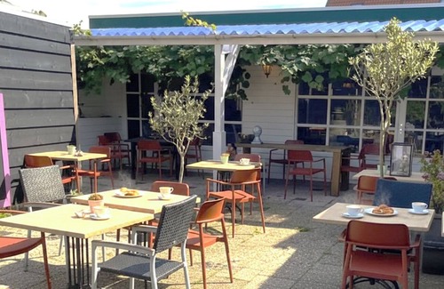 Zoutelande Apartment | Discover the charm of a stylish small seaside room with Ibiza vibes, featuring a private bathroom.