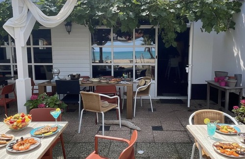 Zoutelande Apartment | Discover the charm of a stylish small seaside room with Ibiza vibes, featuring a private bathroom.