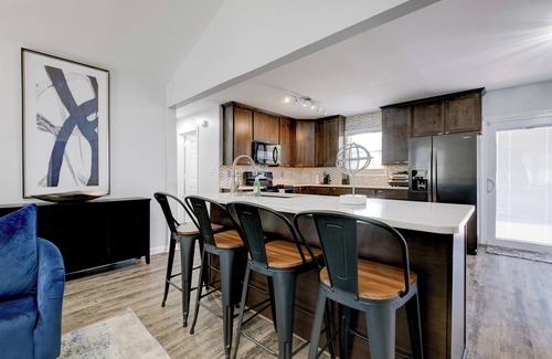 Fairburn Apartment | Discover your ideal Georgia retreat in this fully renovated, 3-bedroom ranch-style Retreat that sleeps 8. Enjoy a spacious master suite, an open-concept kitchen with modern appliances, and chic décor throughout.