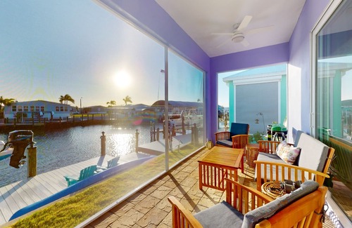 Saint James City House | Dog-friendly, canal-front getaway with a dock, screened lanai, & washer/dryer