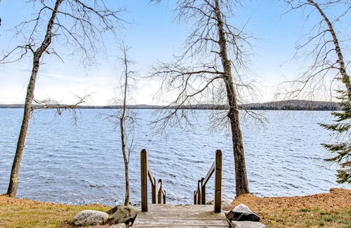 Presque Isle Cabin | Dog-friendly cabin with waterfront views, lake access, sandy beach, & rec room