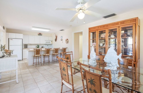 Marathon House | Dog-friendly, canal-front home with seawall dock, heated pool & gas grills