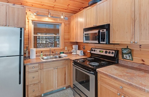 Presque Isle House | Dog-friendly lakefront cabin w/wood fireplace, patio & firepit - kayaks & canoe!