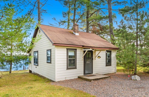 Presque Isle Cabin | Dog-friendly lakefront resort with swimming, fishing, boating, & rec room