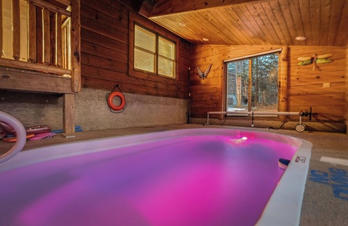 Gatlinburg - Pigeon Forge Cabin | Dog Friendly! Private Indoor Pool, Hot Tub, GameRoom, Firepit & Free Passes.