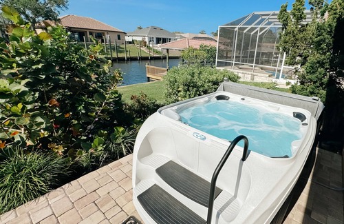 Palm Harbor House | Dog friendly summer escape: Waterfront, Game Room, Hot Tub