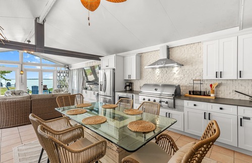 Bay Point House | Dog-friendly waterfront home with outdoor kitchen, bar, firepit, & kayak launch