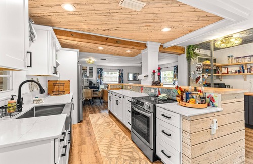 Bay Point House | Dog-friendly waterfront home with outdoor kitchen, bar, firepit, & kayak launch
