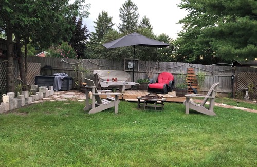 Township of Woolwich Apartment | Doggy heaven. Large fenced yard , beautiful gardens, guest patio and firepit.