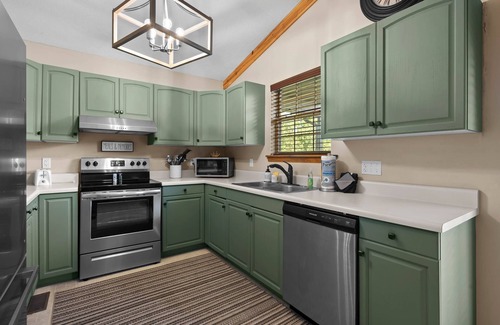 Sevierville Cabin | Dollywood 1 mi! Mountain View! Hot Tub, Fire Pit, King Suites, Arcade, Dogs OK!