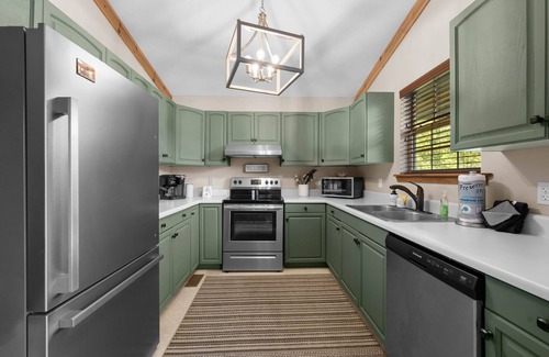 Sevierville Cabin | Dollywood 1 mi! Mountain View! Hot Tub, Fire Pit, King Suites, Arcade, Dogs OK!