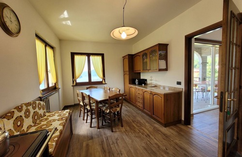 Costa Volpino Villa | Domus Bianca Single villa surrounded by greenery with a wide view of Lake Iseo