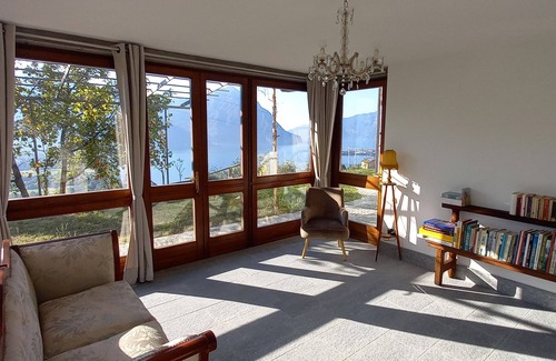 Costa Volpino Villa | Domus Bianca Single villa surrounded by greenery with a wide view of Lake Iseo