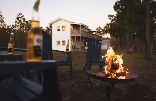 Santa Rosa Beach House | Downstairs lake front unit minutes from the beach! Bonfire, hammock, BBQ, fish!