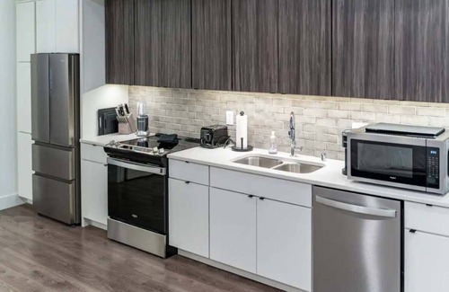 Appleton Apartment | Downtown! Brand New, Modern, Massive Studio with Kitchen + Game Room & Theater.