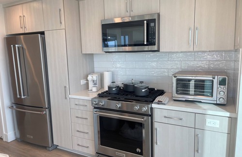 East Village Apartment | Downtown Delight: High-Rise Luxury Retreat with Stunning City Views