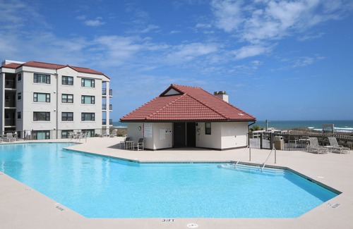 Shell Island Condo | DR 1309 – Getaway to this oceanfront condo with pool and direct beach access