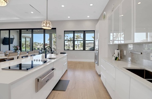 Pelican House | Dream Home Vacation! Stunning Waterfront! Luxurious Resort-Style Lagoon Pool, Spa & Outdoor Living!