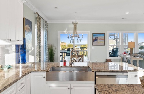 Sunset Beach House | Easy Breezy is a stunning 4 bedroom, 4 bathroom house with a private pool and elevator