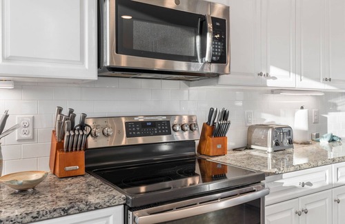 Sunset Beach House | Easy Breezy is a stunning 4 bedroom, 4 bathroom house with a private pool and elevator