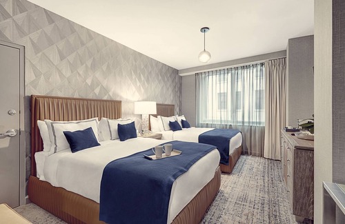 Financial District Hotel | Elegant and Spacious Room with Two Queen Beds for Ultimate Relaxation