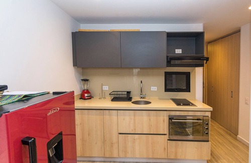 Antiguo Country Apartment | Elegant apartment with view of the city, mountains, 500 MB, swimming pool, gym and spa