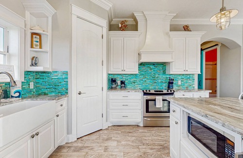 Galveston House | Elegant canal-front home with dock, firepit, deck & kayaks - close to beach