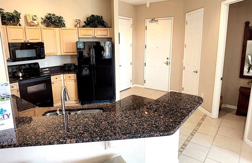 Loughman Condo | Elegant Condo w/Pool View Balcony Resort Pool & Gym. Near Disney/Shops