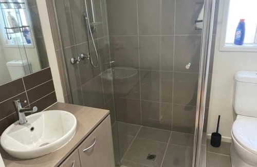 Point Cook House | Elegant master bedroom with private bathroom