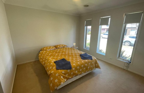 Point Cook House | Elegant master bedroom with private bathroom