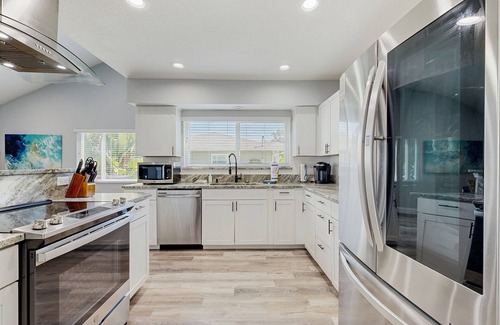 Palm Harbor House | Elegant sound view home with enclosed pool, dock, pool table, fireplace, & grill