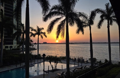Fort Myers Condo | Elegant, Upscale Waterfront Condo! Unforgettable Sunsets! Stunning Pool & Pool Deck! Free Parking