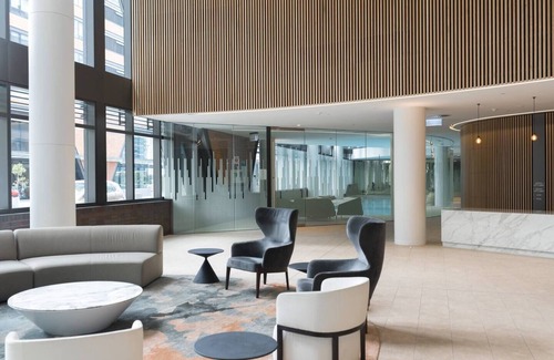 Docklands Apartment | Elevated Waterfront Stay with Indoor Pool and Views