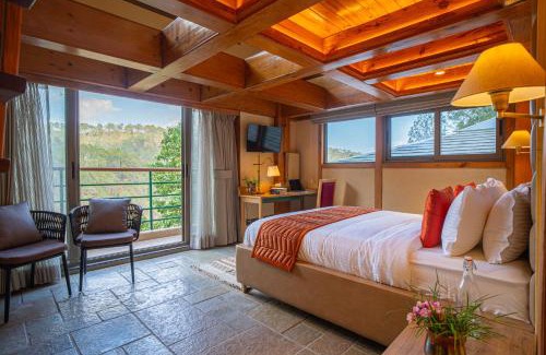 Shyamkhet Villa | ELIVAAS Blushing Pines 3 BHK With Indoor Pool, Attic and Classy Interiors