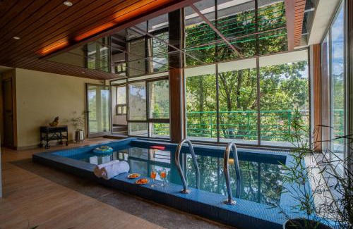 Shyamkhet Villa | ELIVAAS Blushing Pines 3 BHK With Indoor Pool, Attic and Classy Interiors