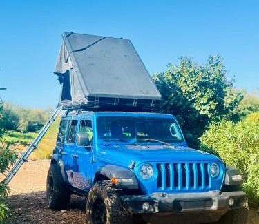 Paia Other | Embark on a journey through Maui with Aloha Glamp's jeep and rooftop tent allows you to discover diverse campgrounds, unveiling the island's beauty from unique perspectives each day