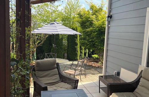 Atlantic House | Emerald City Retreat: Cozy 2BR Home with Backyard & Patio