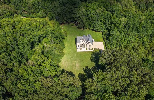 Collierville House | Enchanted Manor: A Luxurious Tudor-Style Retreat Amidst Nature's Splendor