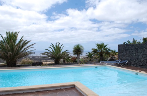 La Asomada Apartment | Enchanting holiday apartment with sea view in private villa with pool