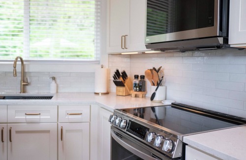 Hayden Lake House | Enchanting lake view 3-bedroom house in the woods in Hayden Lake, hot tub, A/C