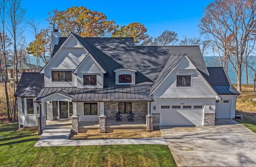 Riverside House | Enchanting lakefront home with pool, hot tub, firepit, game room, & washer/dryer
