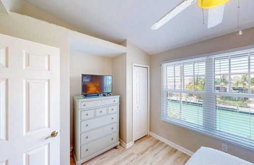 Marathon House | Enchanting waterfront townhouse with balcony, plunge pool, & washer/dryer