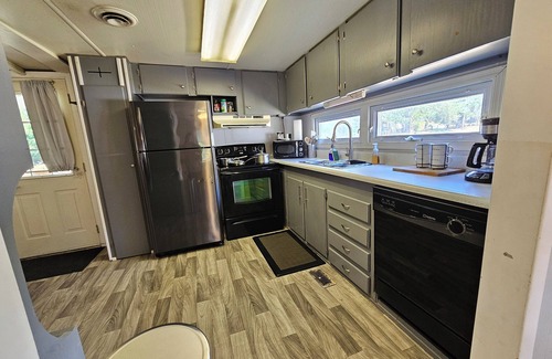 Adamstown House | Enjoy a Peaceful environment with neighboring mini pones a fire pit to sit under the stares. roll into the oversized parking lot and enjoy this lovely modern farm home.