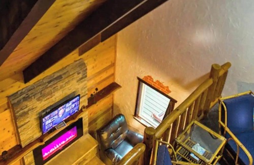 Rice Lake Ski Chalet | Enjoy a quiet stay on your own private deck by the lake in Room 21: Ponderosa-a Western Themed Chalet