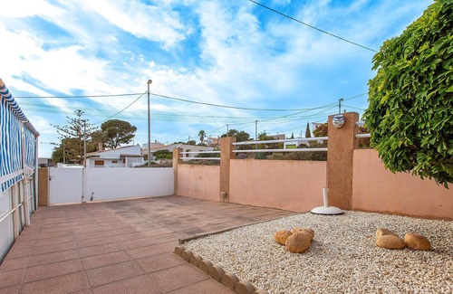 Los Puertos Apartment | Enjoy a relaxing vacation by the sea in this vacation apartment with a beautiful conservatory.