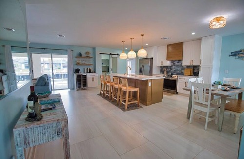 Punta Gorda House | Enjoy a tranquil vacation on expansive canal with passing boats and heated pool.