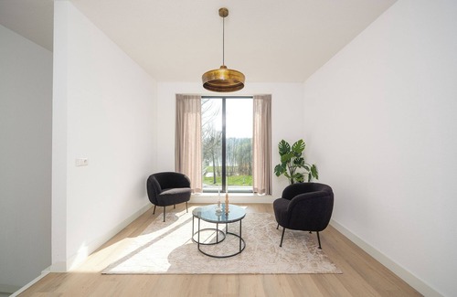 Zeewolde House | Enjoy luxury in the vacation villa Moon: 8-person villa with whirlpool, sauna and terrace by the water. Modern and spacious, ideal for a relaxing vacation!