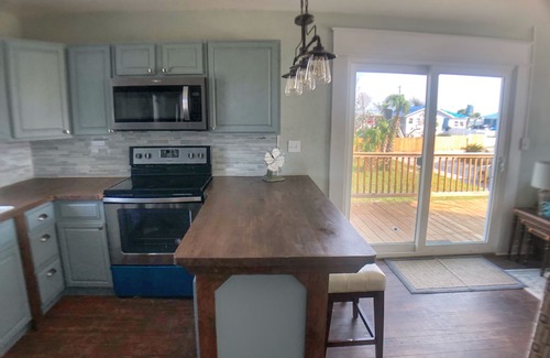 Port St. Joe Cottage | Enjoy sunrise and sunsets on the huge deck and covered bar!